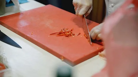 Cook cuts the pepper with a knife Stock Footage 81543489