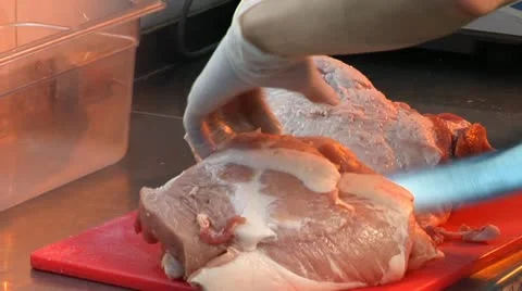 Cook cuts a piece of meat Vídeo Stock 12140359