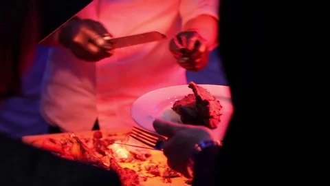 Cook cuts a piece of meat Stock Footage 82108631