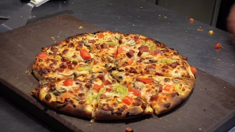 The cook cuts the pizza. Stock Footage 92005383