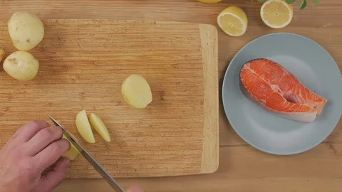 Cook Cuts Potatoes Stock Footage 125853671