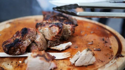The cook cuts the prepared meat  Stock Footage 116769897