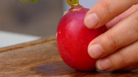 The cook cuts the radish into slices Video stock 84477258