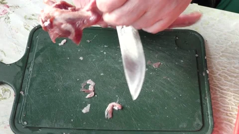The cook cuts raw deer meat with a knife. healthy food concept Video stock 151019308