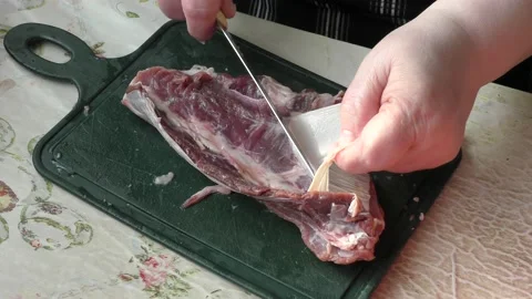 The cook cuts raw deer meat with a knife. healthy food concept Stock-Footage 151019799