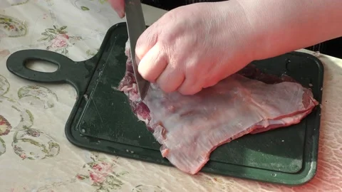 The cook cuts raw deer meat with a knife. healthy food concept Stock Footage 151019816