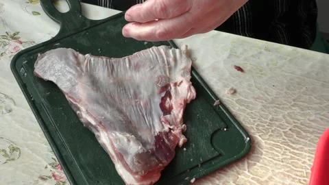 The cook cuts raw deer meat with a knife. healthy food concept Видео 151020226