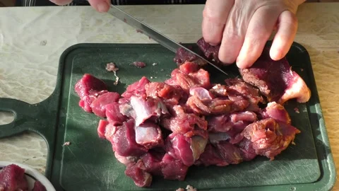 The cook cuts raw deer meat with a knife. healthy food concept 스톡 동영상 151020662