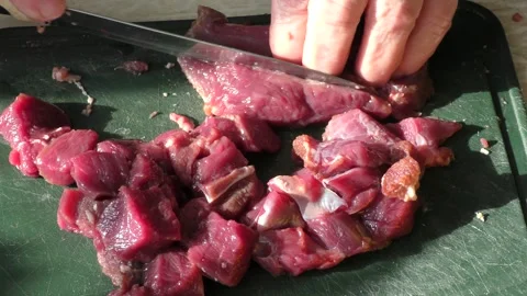 The cook cuts raw deer meat with a knife. healthy food concept 스톡 동영상 151021111