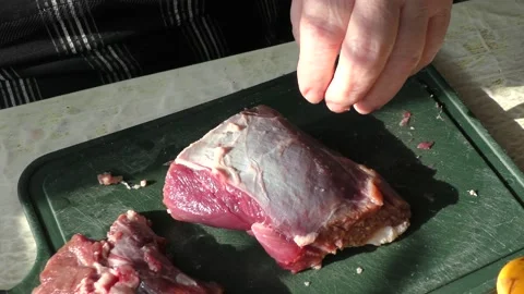 The cook cuts raw deer meat with a knife. healthy food concept 動画素材 151022484