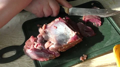 The cook cuts raw deer meat with a knife. healthy food concept Vídeo Stock 151023121