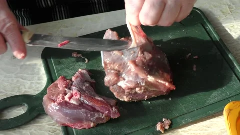 The cook cuts raw deer meat with a knife. healthy food concept 스톡 동영상 151023336