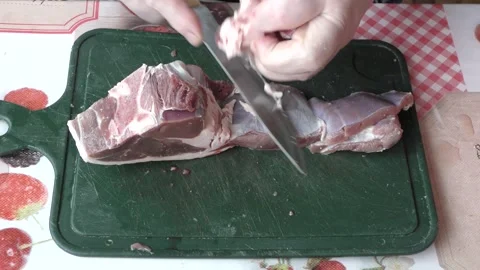 The cook cuts raw deer meat with a knife.  healthy food concept Stock Footage 154846421