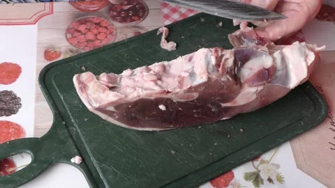 The cook cuts raw deer meat with a knife.  healthy food concept Stock Footage 154846429