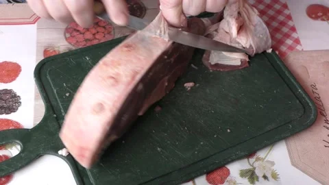 The cook cuts raw deer meat with a knife.  Healthy food concept Stock Footage 155066628