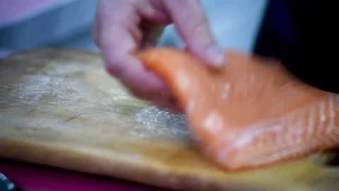 Cook cuts the red fish. 動画素材 75607783