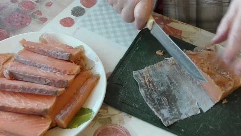 The cook cuts salmon fish into pieces. healthy food concept Stock Footage 196997904