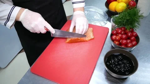 Cook cuts the salmon. Stock Footage 122397603