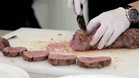 Cook cuts into segments meat Stock Footage 48867516