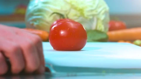 Cook cuts  tomato Stock Footage 134470611