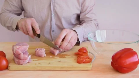 The cook cuts the turkey slices into small slices. Stock Footage 152074607
