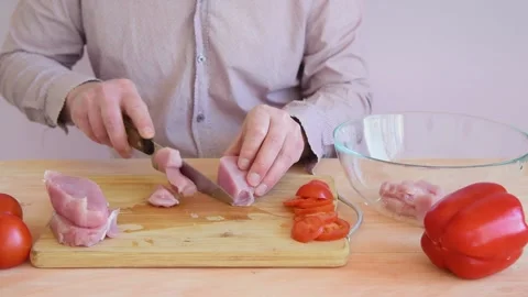 The cook cuts the turkey slices into small slices. Stock Footage 152074627