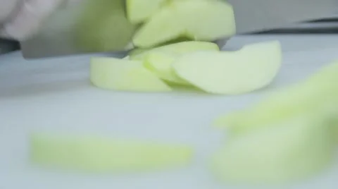 Cook is cutting an apple on the cutting board 스톡 동영상 48395735