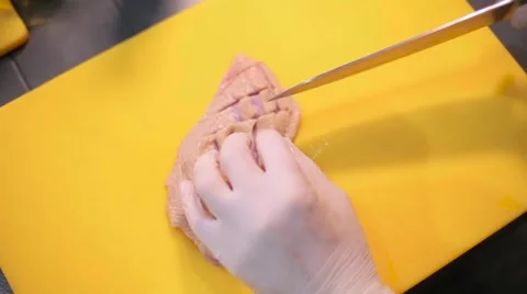Cook cutting the chicken meat Stock Footage 67863098