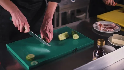 Cook cutting cucumber Stock Footage 89231906