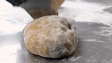 The cook cutting dough for making bread Stock Footage 160736297