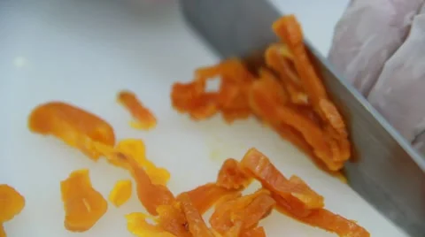 Cook is cutting drued apricots on white cutting desk 스톡 동영상 48396337
