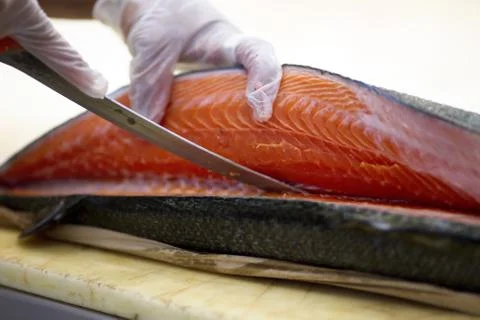 Cook cutting fish Stock Photos