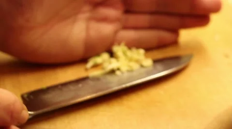 Cook cutting garlic Stock Footage 47210517