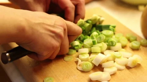 Cook cutting leek in the kitchen Video stock 47210567
