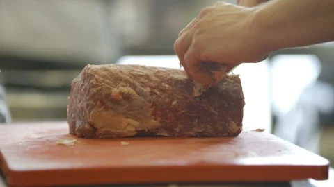 Cook Cutting Meat In Kitchen Stock Footage 127036475