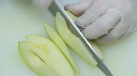 Cook is cutting a pear 스톡 동영상 48397466