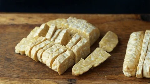 Cook cutting tempeh Stock Footage 71676781