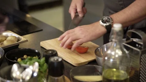 Cook cutting tomatoes Stock Footage 77232412