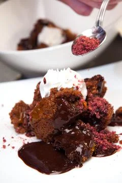 The cook decorates the dessert before serving Stock Photos