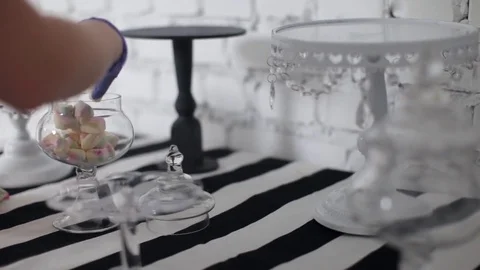 Cook Decorates a Table For a Children's Holiday. Pours Marshmallow Stock-Footage 77496146
