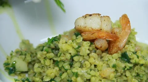 Cook is decorating meal with greens Stock Footage 48396279