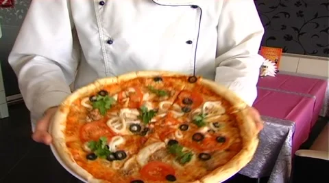 Cook delivers pizzas in the restaurant Stock Footage 61269968