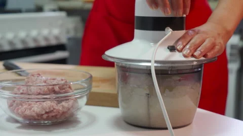Cook Diligently Chops Fresh Onions In Electric Blender For Tasty Meal Stock Footage 321638838