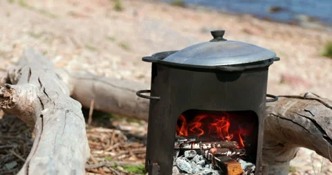 Cook the dish over an open fire. Stock Footage 157856976