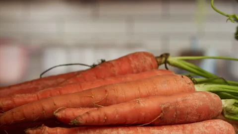 Cook dropping carrots for cooking Stock Footage 156845882