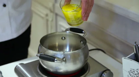 Cook the eggs in a pot pours Stock Footage 59356324