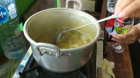 Cook fish gravy Stock Footage 233488120