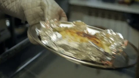 Cook foil the meat in wrap and get it from the grill soon already done Stock Footage 78486839