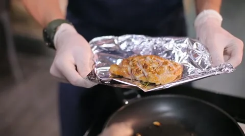 Cook foil the meat in wrap Stock Footage