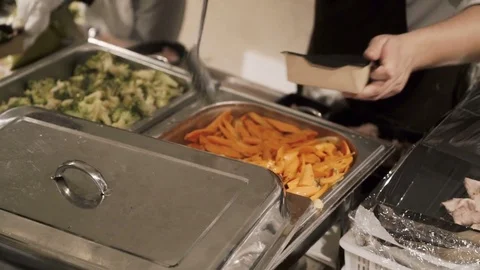 The cook food into disposable dishes Stock Footage 83002653